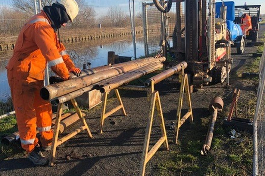 Comacchio GEO rotary rig with drill string laid out on site