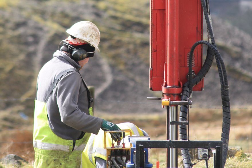 Geotron operator working the controls of a window sampling rig